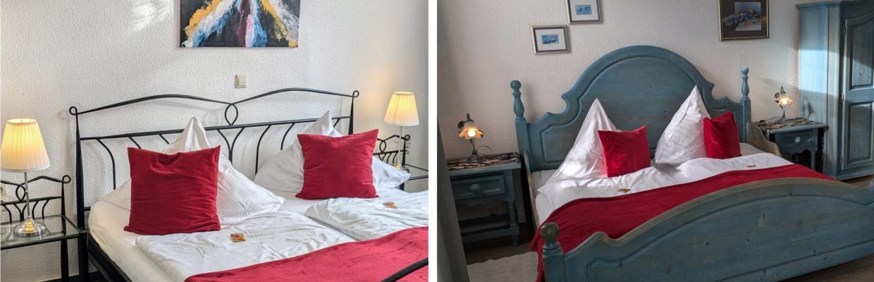 Komfortable Doppelzimmer im Hotel Jägerhof in Mayen mit einem Doppelbett, dekoriert mit roten Kissen und einer gemütlichen Kuscheldecke. Das Zimmer verfügt über ein eigenes Bad mit Dusche und Kosmetikspiegel und wird täglich für Sie gereinigt.